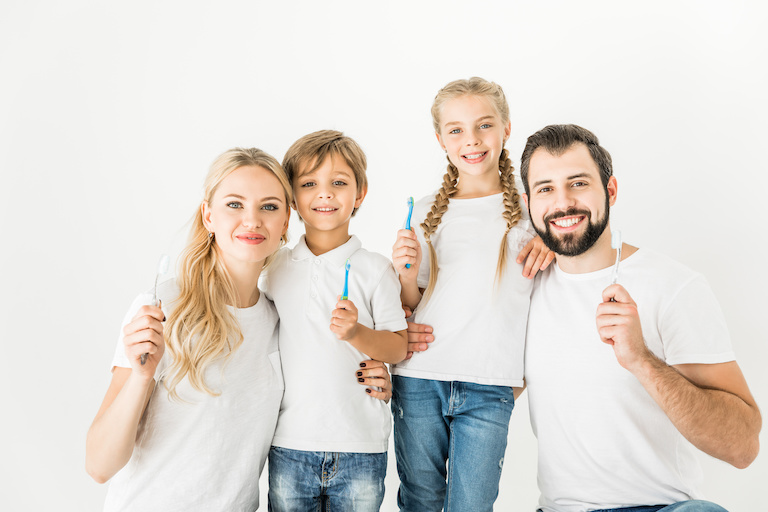 Photo of a family brushing their teeth